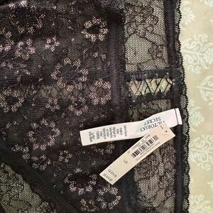 Victoria’s Secret Lace Panty Black w/Gold details. X design on back size L. NWT